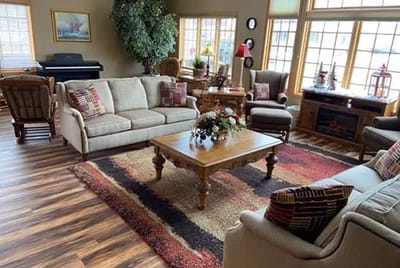 Bright common area with comfortable furniture and decor