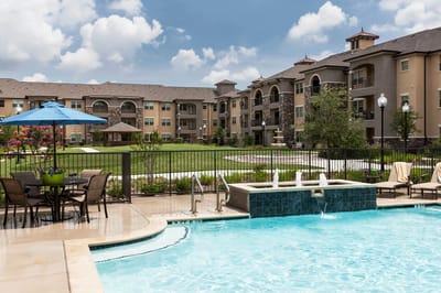 View of the outdoor pool and buildings at the facility