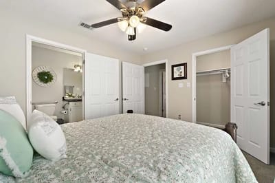 Interior view of a private resident room with a bed