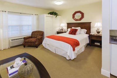 Cozy private room with a bed and seating area