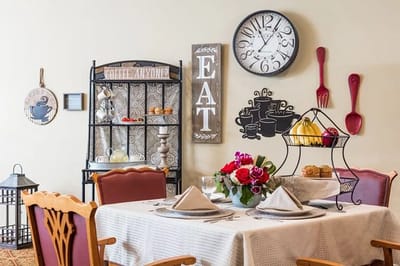 Elegant dining area with table and decorative elements