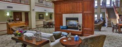 Common area with seating and fireplace in the facility