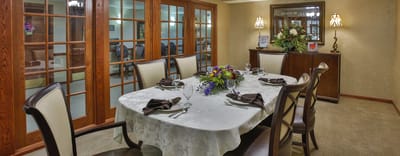 Elegant dining room setup with floral decorations