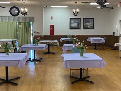 Dining area with tables and floral centerpieces