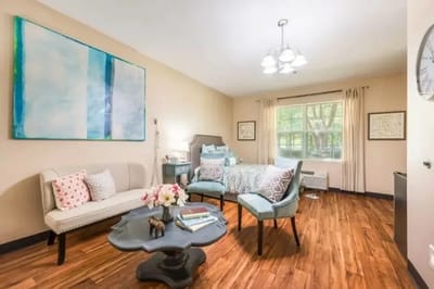 A cozy resident room with modern furnishings