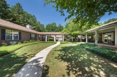 Pathway through landscaped outdoor space at a care facility