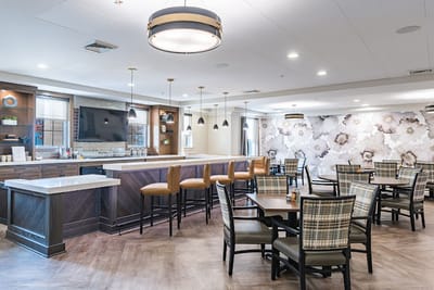 Bright dining area with tables and chairs