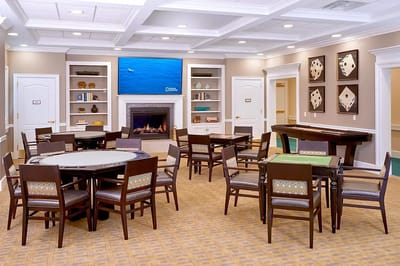 Common area with tables and chairs for games