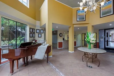 Interior view of a common area with a piano