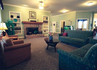 Comfortable common area with couches and fireplace