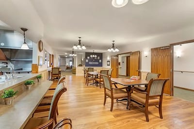 Bright common area with seating and tables