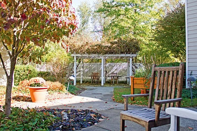 Outdoor seating area with garden and pergola