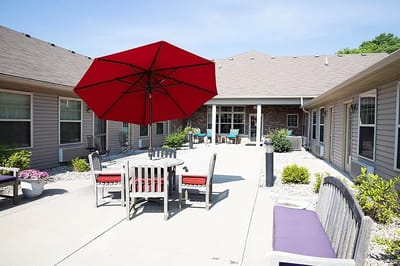 Outdoor patio with seating and umbrella
