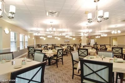 Bright dining room with tables set for meals