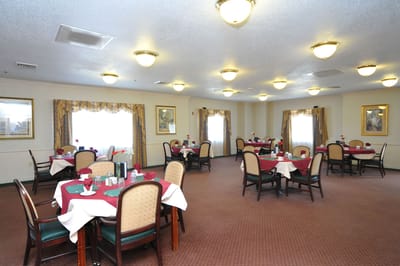 Dining room setup with tables and flowers