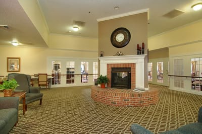 Interior view of a cozy common area with a fireplace