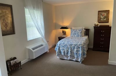 Cozy private resident room with floral bedding
