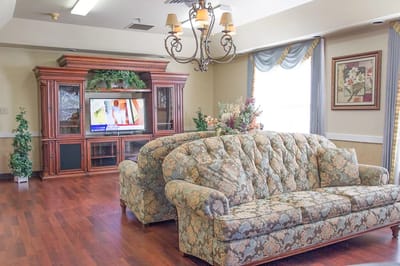 Common area with floral couch and TV