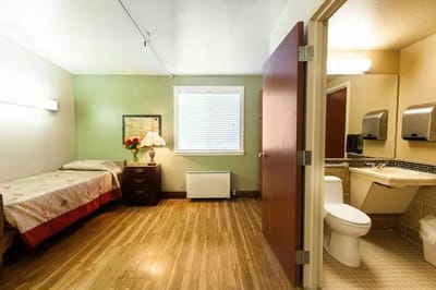 Private resident room with bed and bathroom