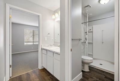 Bright, modern bathroom of a resident unit