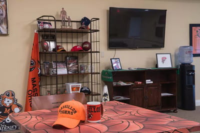 Interior view of a common area with sports memorabilia.