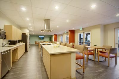 Bright common area with kitchen and dining space