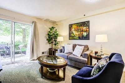 Cozy living room with seating and patio access