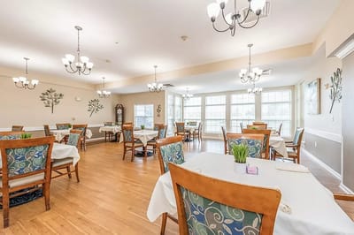 Dining area with tables and chairs, bright lighting