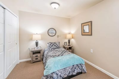Cozy private room with bed and lamps