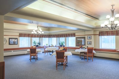 Bright dining room with tables set for meals