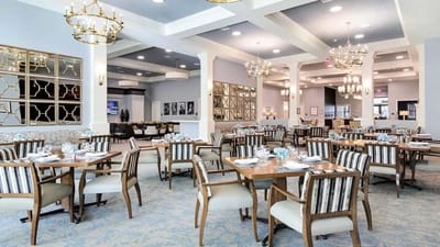 Elegant dining room with tables set for meals