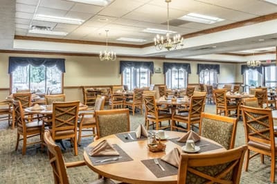 Bright and spacious dining room with tables set up for meals