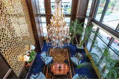 Elegant common area with chandelier and seating
