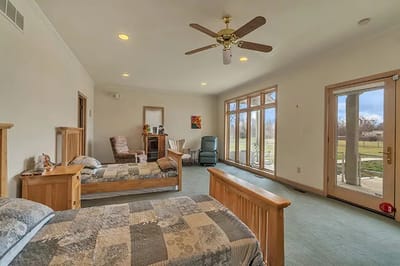 Bright, spacious resident room with two beds and seating area