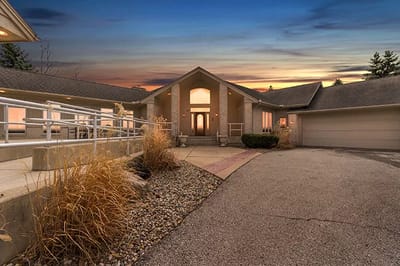Exterior view of an assisted living facility during sunset