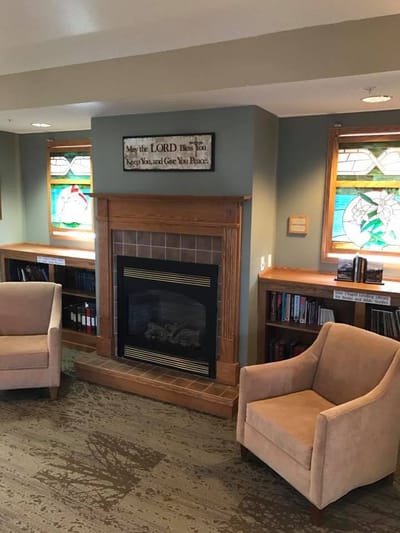 Cozy common area with seating and decorative windows