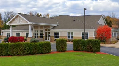 Exterior view of Ellen's Home with colorful landscaping