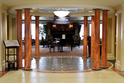 Interior view of a welcoming lobby with piano.