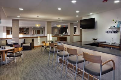 Interior view of a common area with seating and a bar