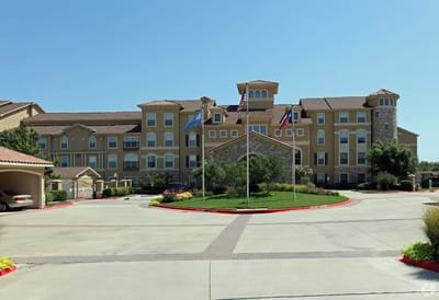 Exterior view of Evergreen at Plano with landscaping