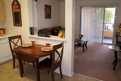 Cozy dining area with a living room visible in the background