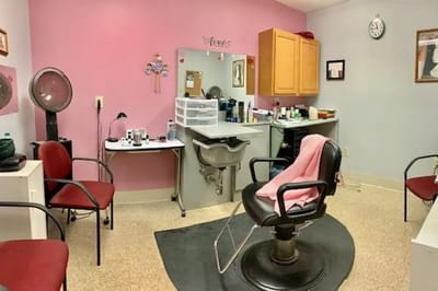 Interior beauty salon with styling chairs and mirrors