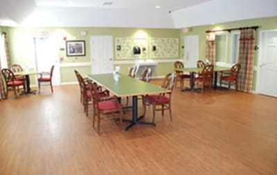 Bright common area with dining tables and chairs