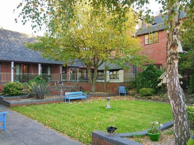 Outdoor garden area with seating and trees