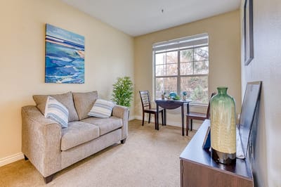 Cozy sitting area with a couch and artwork
