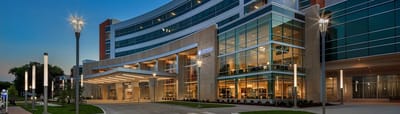 Exterior view of a modern assisted living facility at dusk