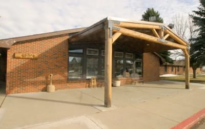 Exterior view of the facility entrance with a covered porch