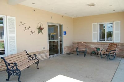 Outdoor entrance area with benches and star decoration