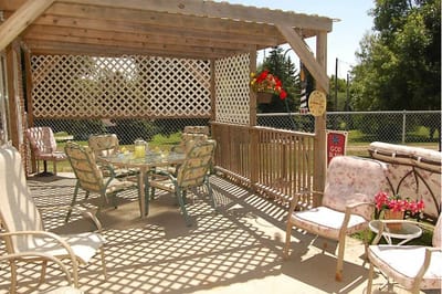 Outdoor patio area with seating and a table