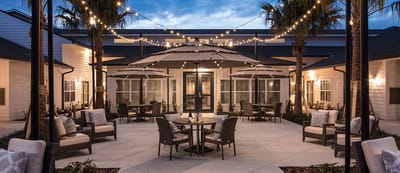 Outdoor patio area with seating and string lights